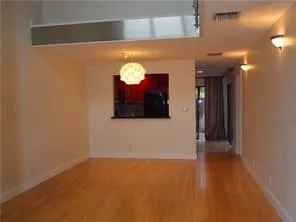 a view of a big room with wooden floor