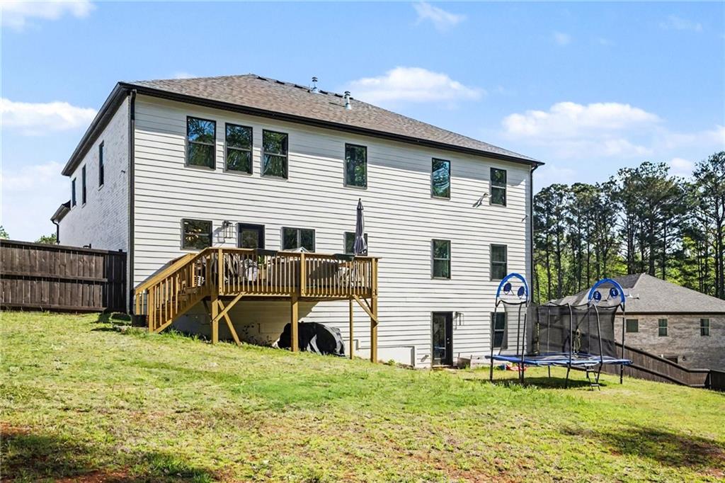 130 Serenity Way Conyers, GA 30013 - Photo 34 of 34 a view of a house with a yard and sitting area