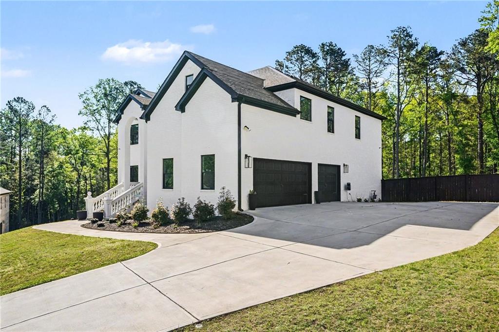 130 Serenity Way Conyers, GA 30013 - Photo 4 of 34 a front view of a house with a yard