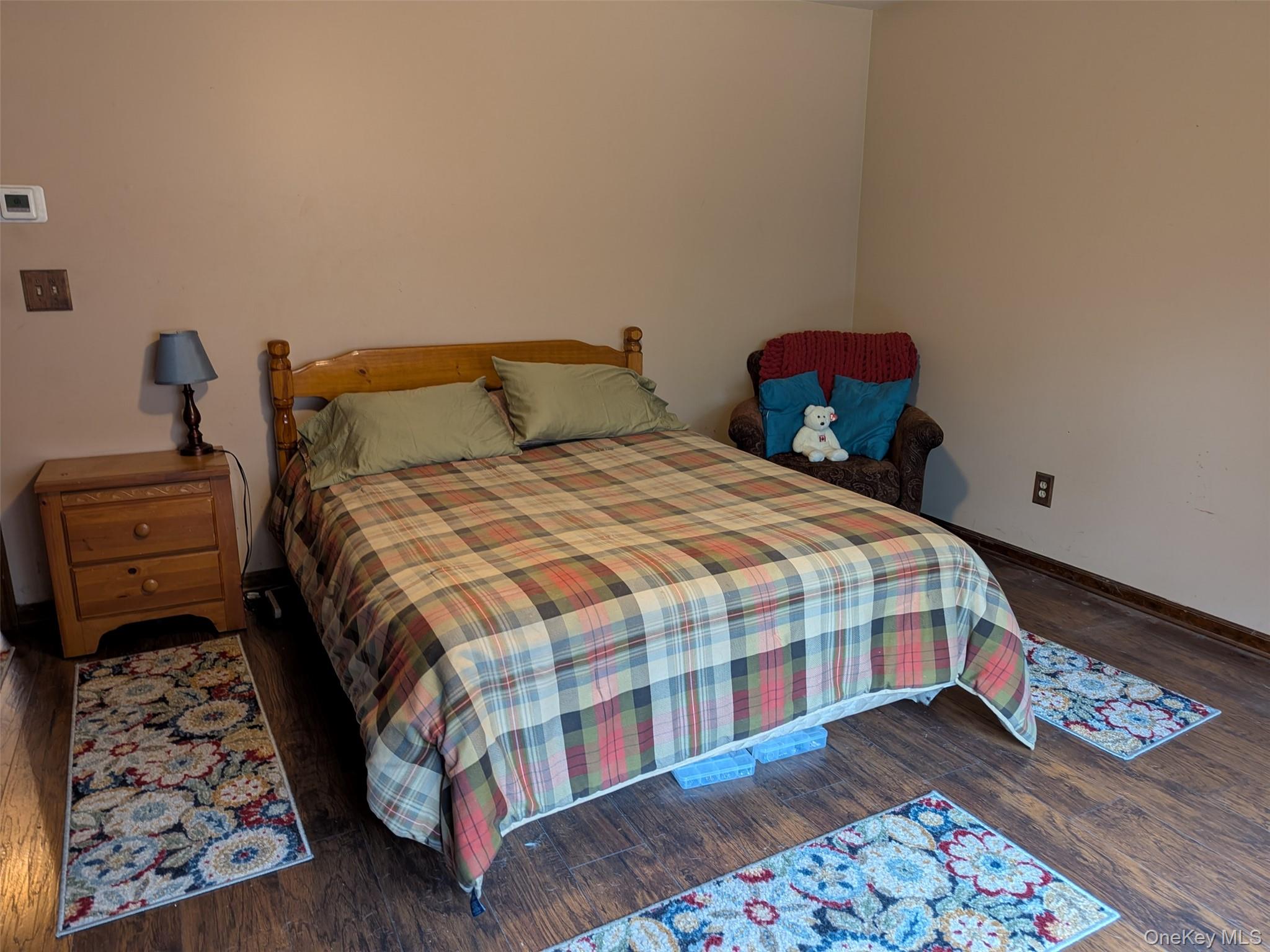 152 Old Forestburg Road Sparrowbush, NY 12780 - Photo 17 of 32 a bedroom with a bed and wooden floor