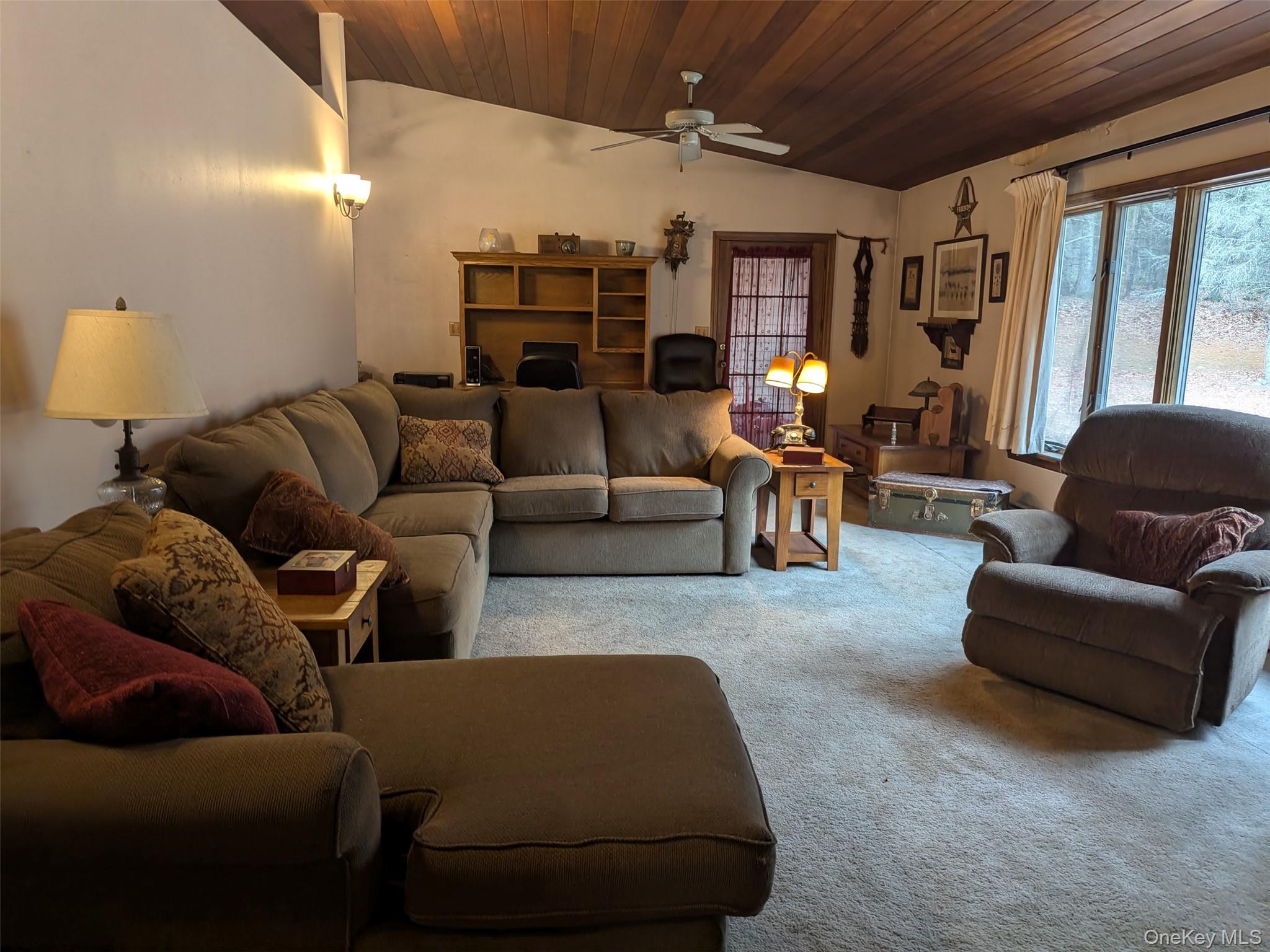 152 Old Forestburg Road Sparrowbush, NY 12780 - Photo 19 of 32 a living room with furniture and a chandelier