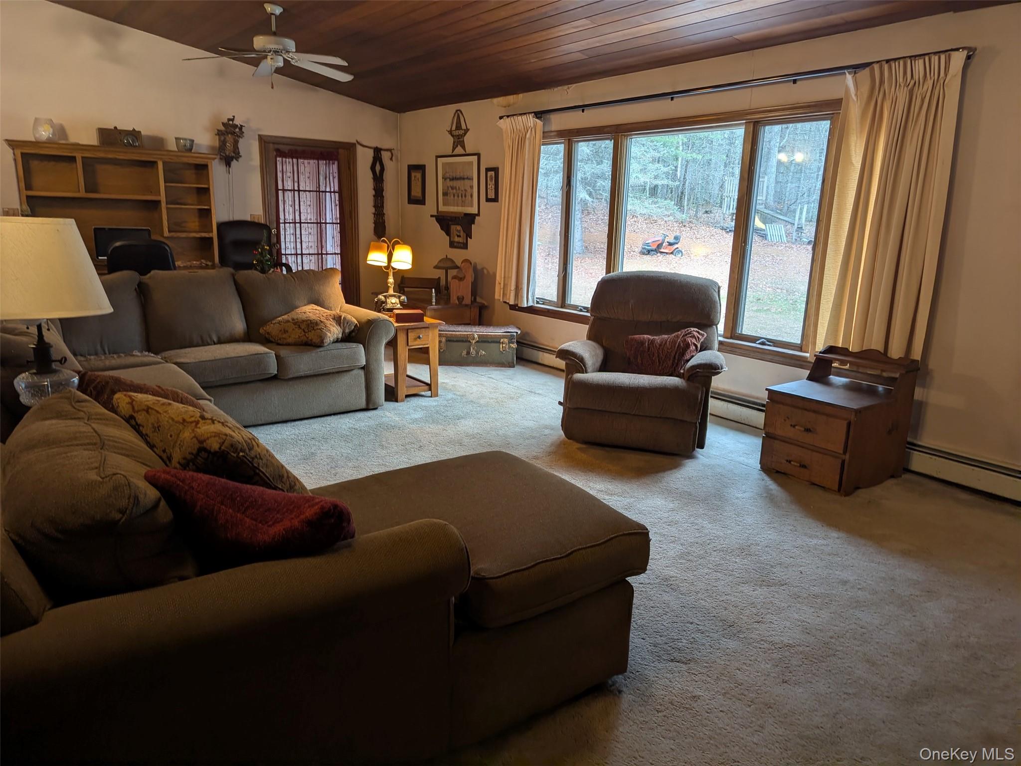 152 Old Forestburg Road Sparrowbush, NY 12780 - Photo 3 of 32 a living room with furniture and a large window
