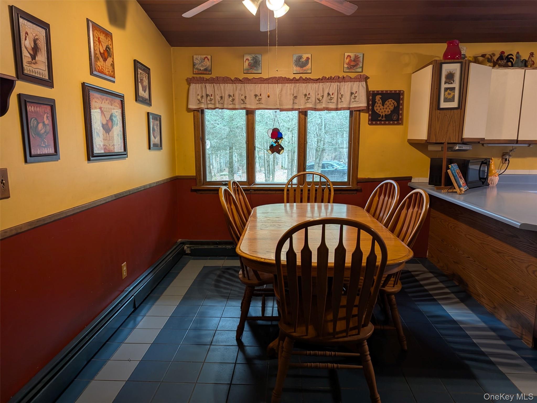 152 Old Forestburg Road Sparrowbush, NY 12780 - Photo 5 of 32 a view of a dining room with furniture a chandelier and wooden floor