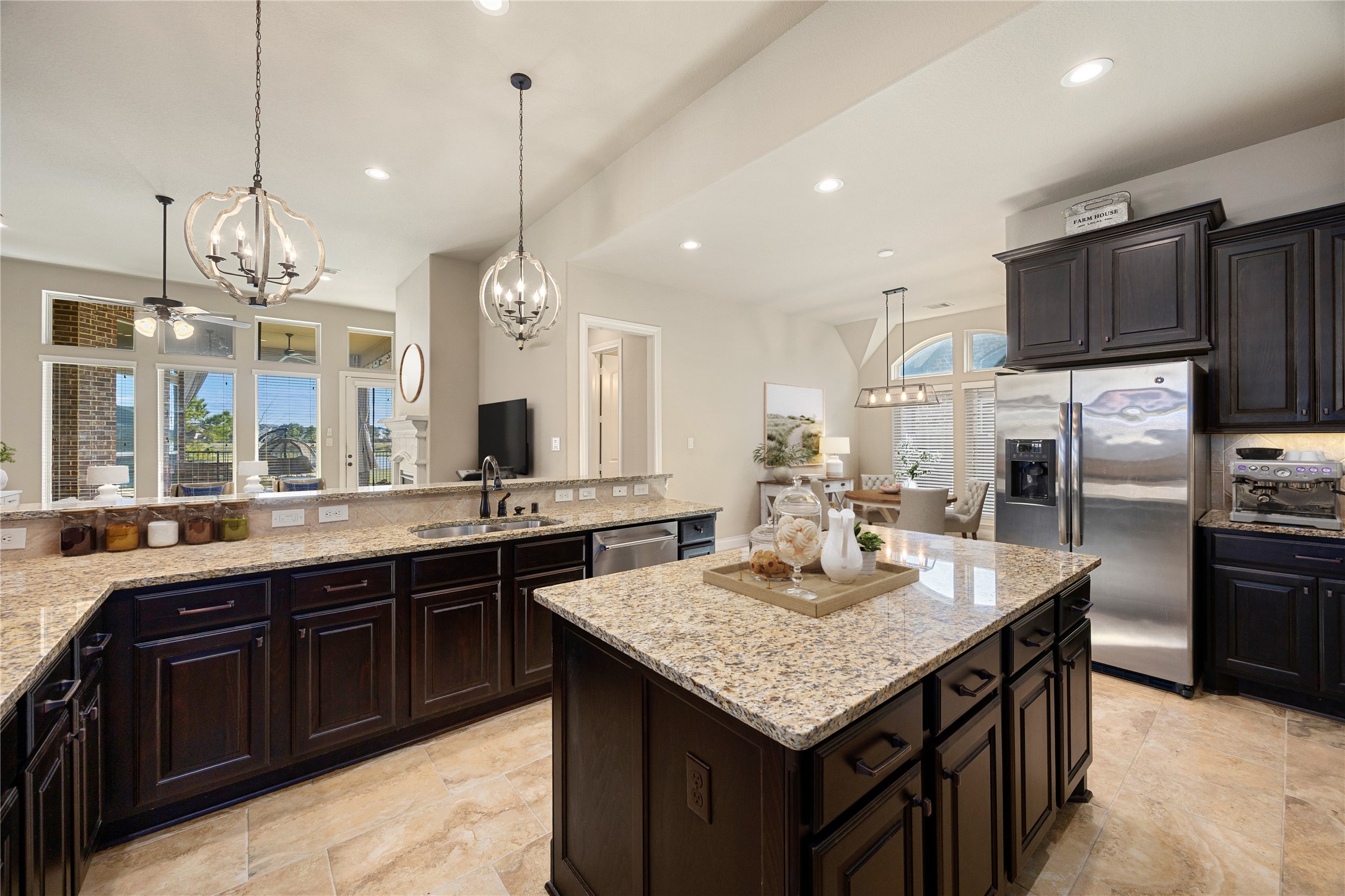 23211 Ruspino Shores Place Katy, TX 77493 - Photo 10 of 39 a kitchen with granite countertop center island and stainless steel appliances