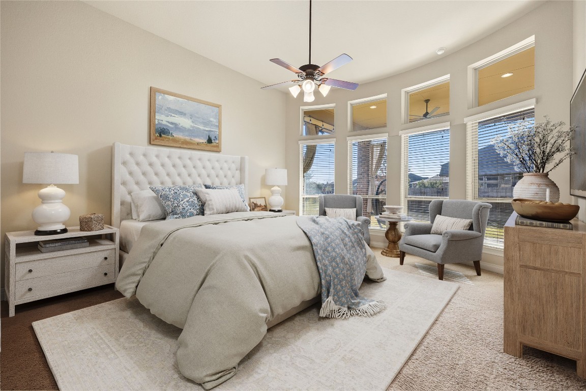 23211 Ruspino Shores Place Katy, TX 77493 - Photo 19 of 39 a bedroom with a large bed and a couch