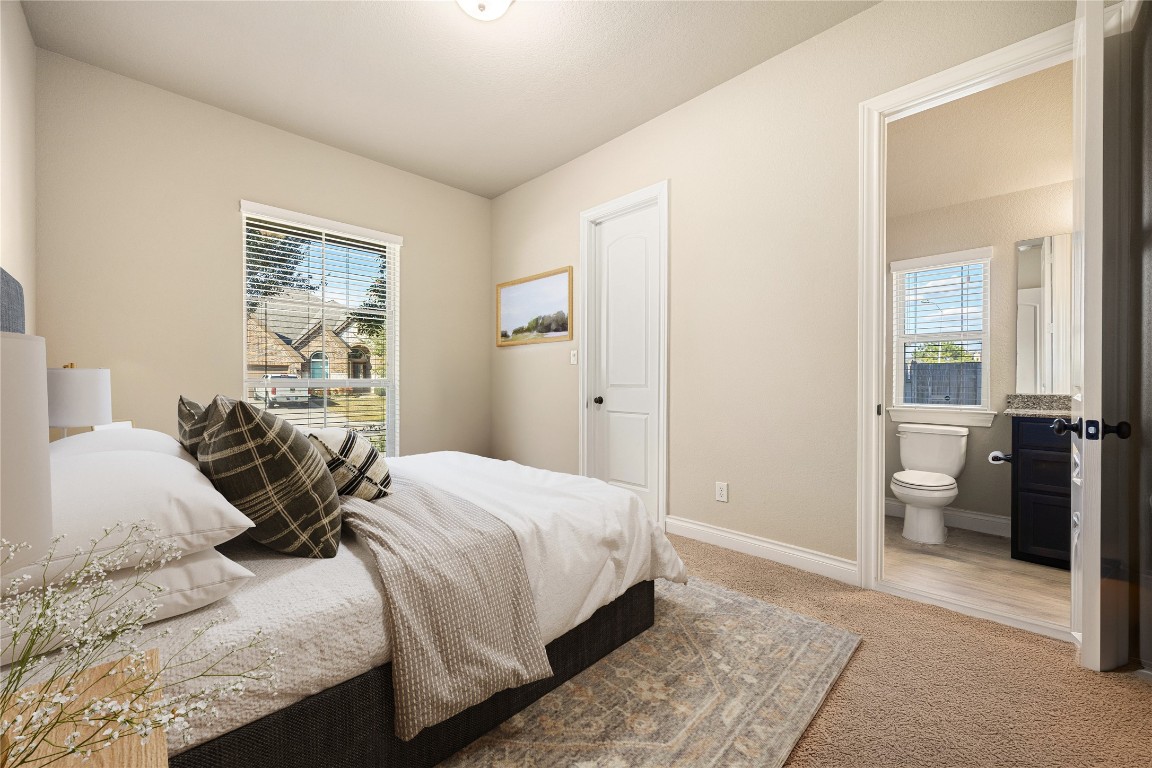 23211 Ruspino Shores Place Katy, TX 77493 - Photo 25 of 39 a bedroom with a bed and a couch