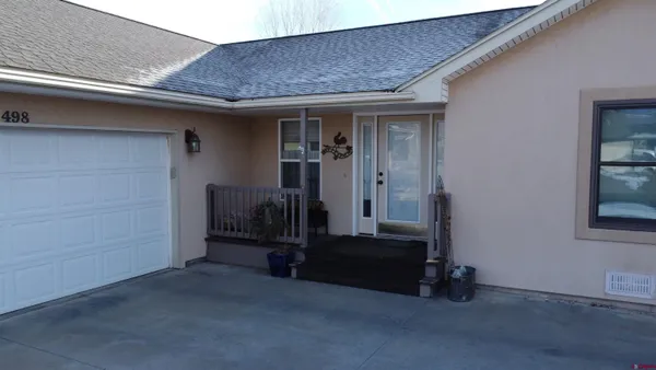 a view of a backyard of the house