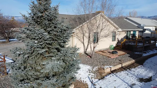 a view of a backyard of the house