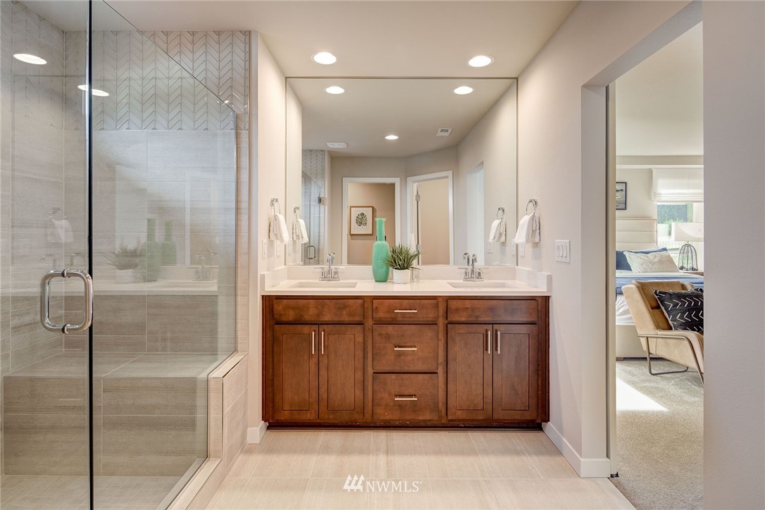11 215th Street Southeast, Unit 1 Bothell, WA 98021 - Photo 13 of 18 a bathroom with a mirror sink and double vanity