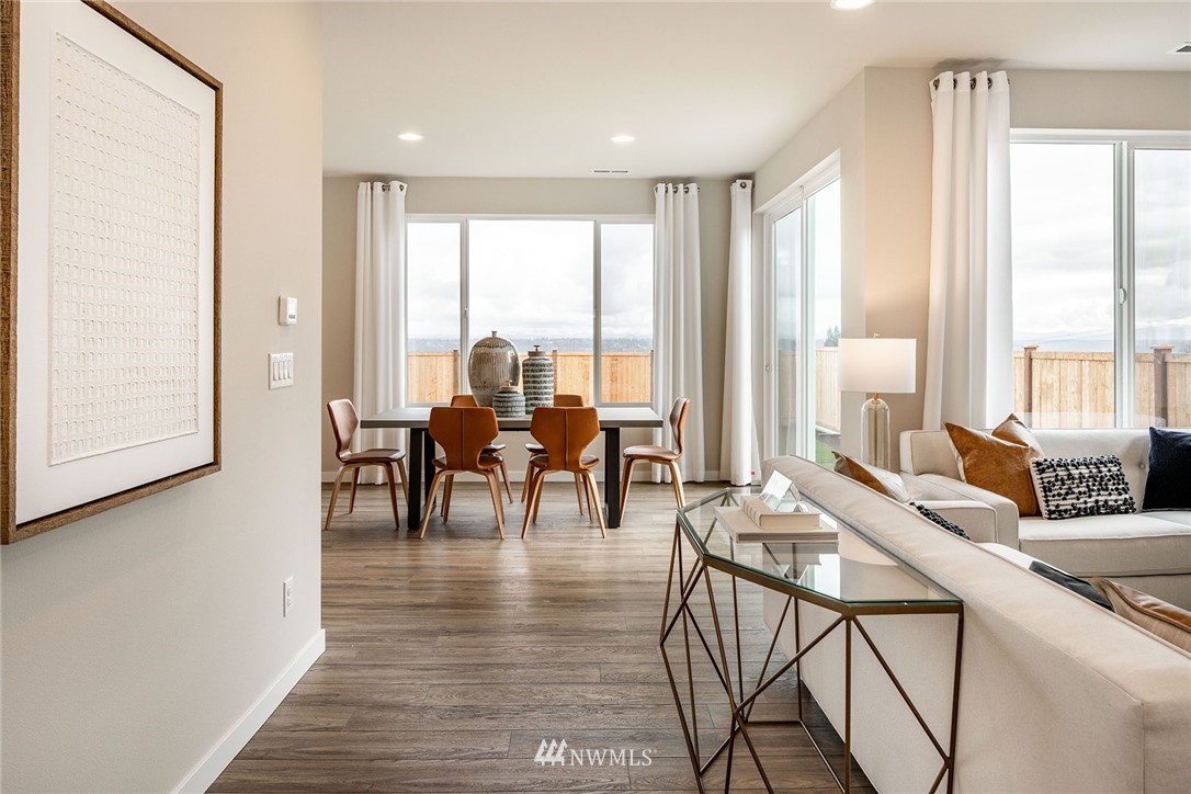11 215th Street Southeast, Unit 1 Bothell, WA 98021 - Photo 7 of 18 a living room with furniture and large windows