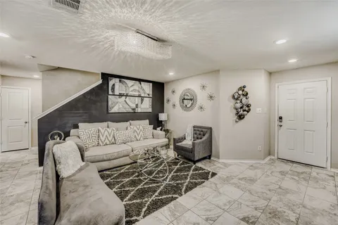 a living room with furniture and window