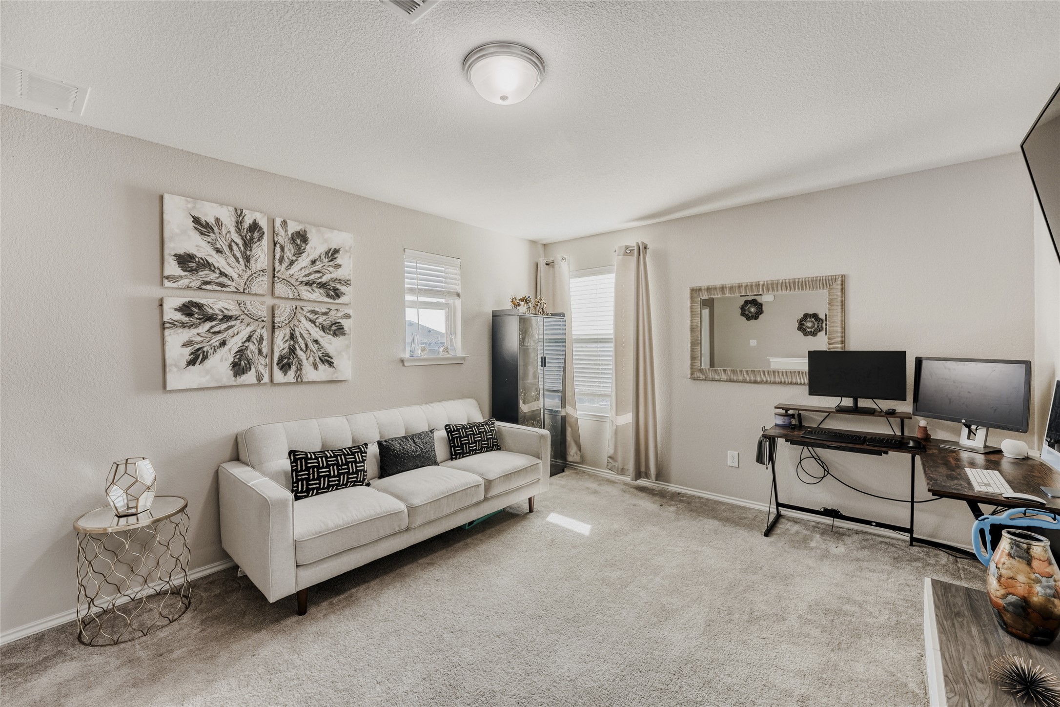 13604 Vigilance Street Manor, TX 78653 - Photo 2 of 28 a living room with furniture and a painting