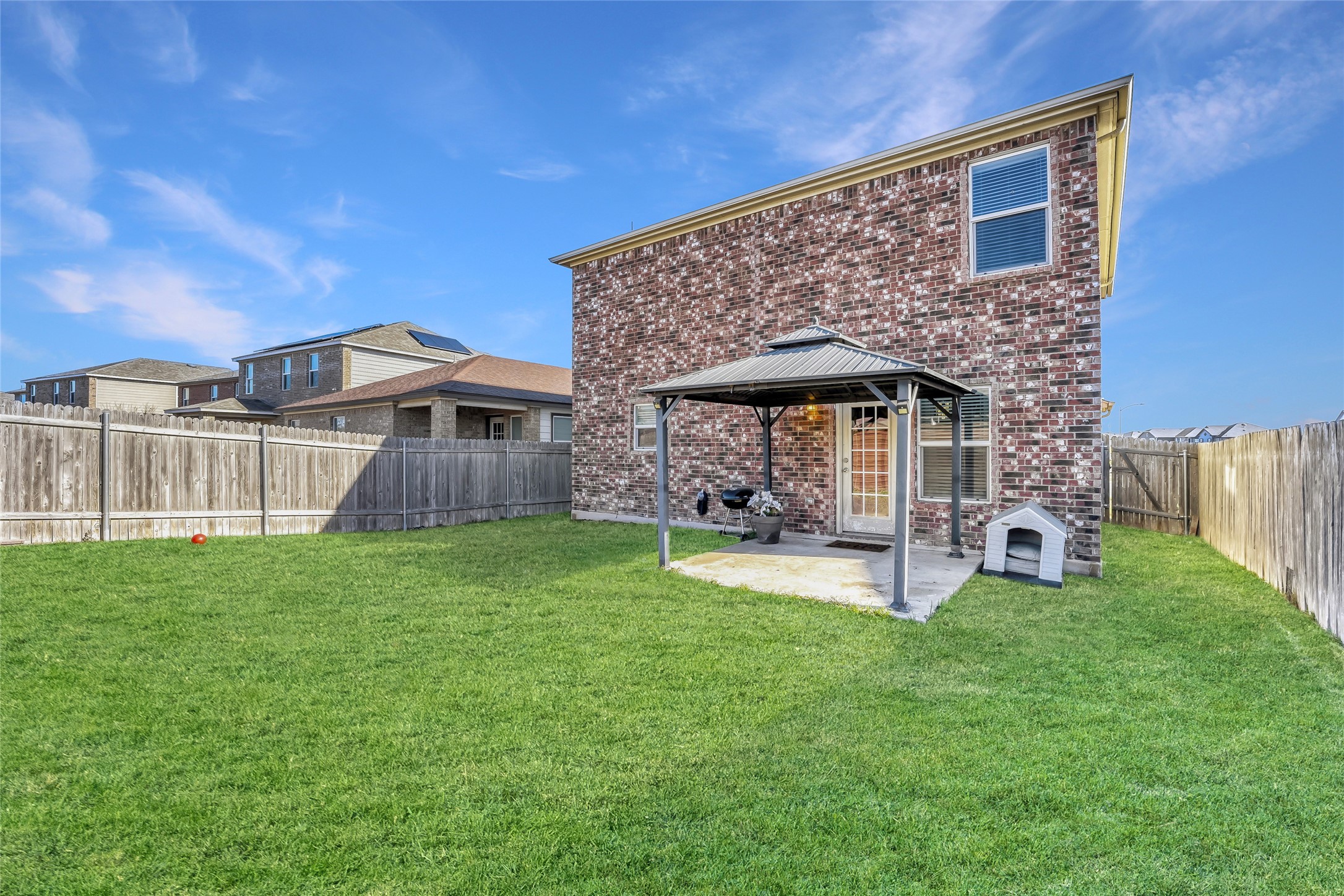 13604 Vigilance Street Manor, TX 78653 - Photo 27 of 28 a front view of a house with garden