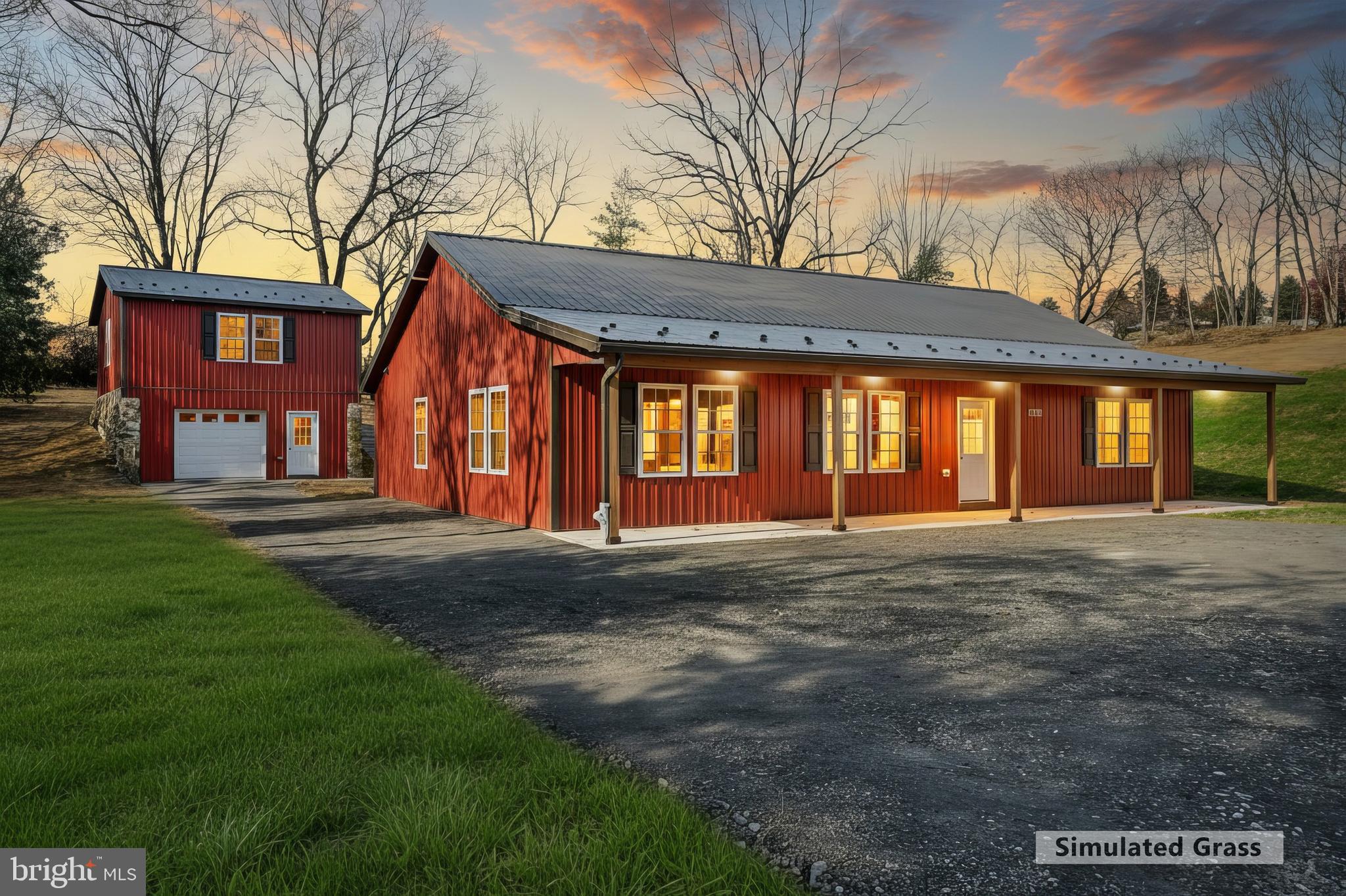 10640 Enfield Road Felton, PA 17322 - Photo 1 of 59 a front view of a house with garage