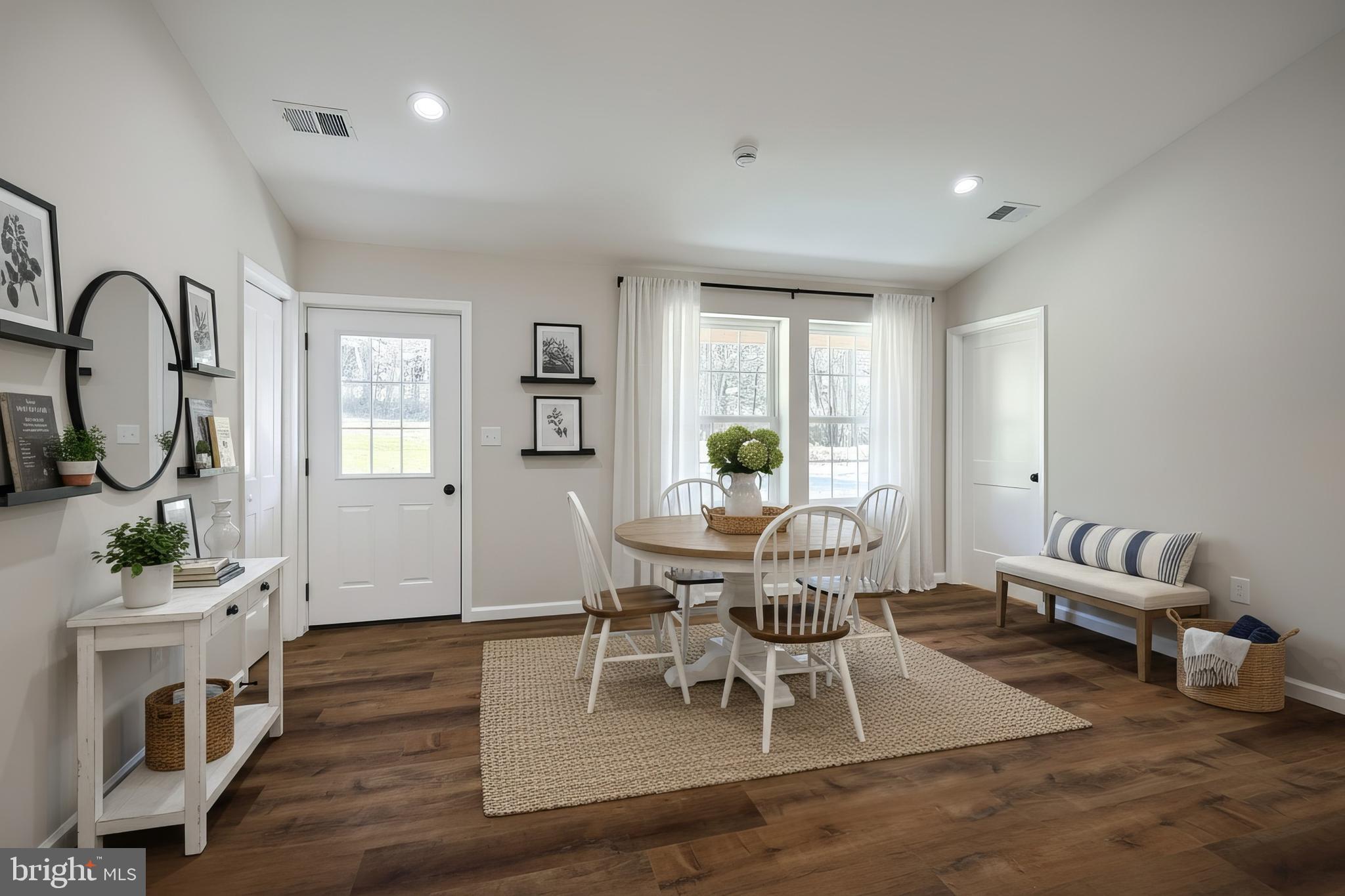 10640 Enfield Road Felton, PA 17322 - Photo 17 of 59 a living room with furniture a potted plant and a large window