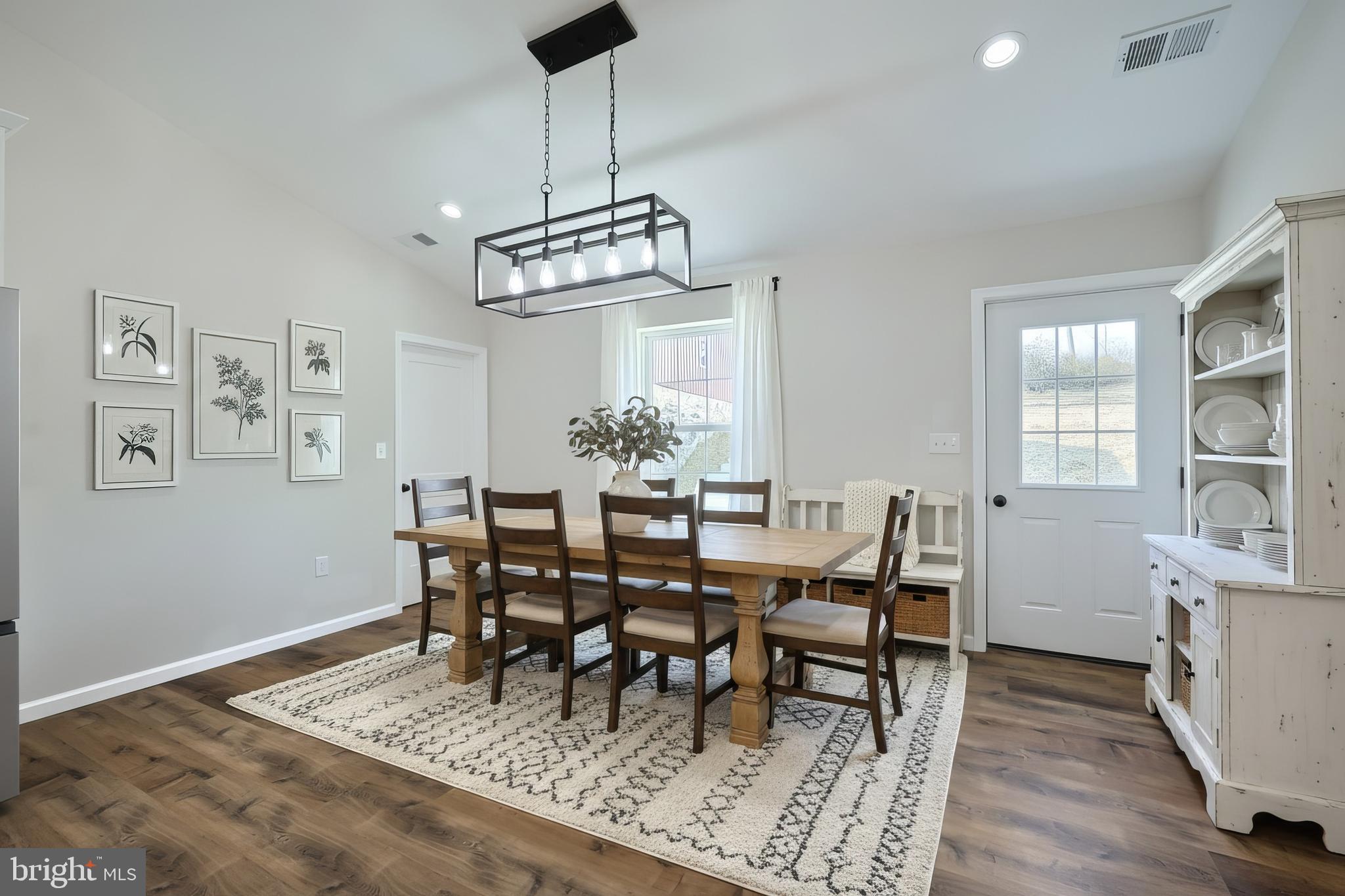 10640 Enfield Road Felton, PA 17322 - Photo 18 of 59 a view of a dining room with furniture window and wooden floor