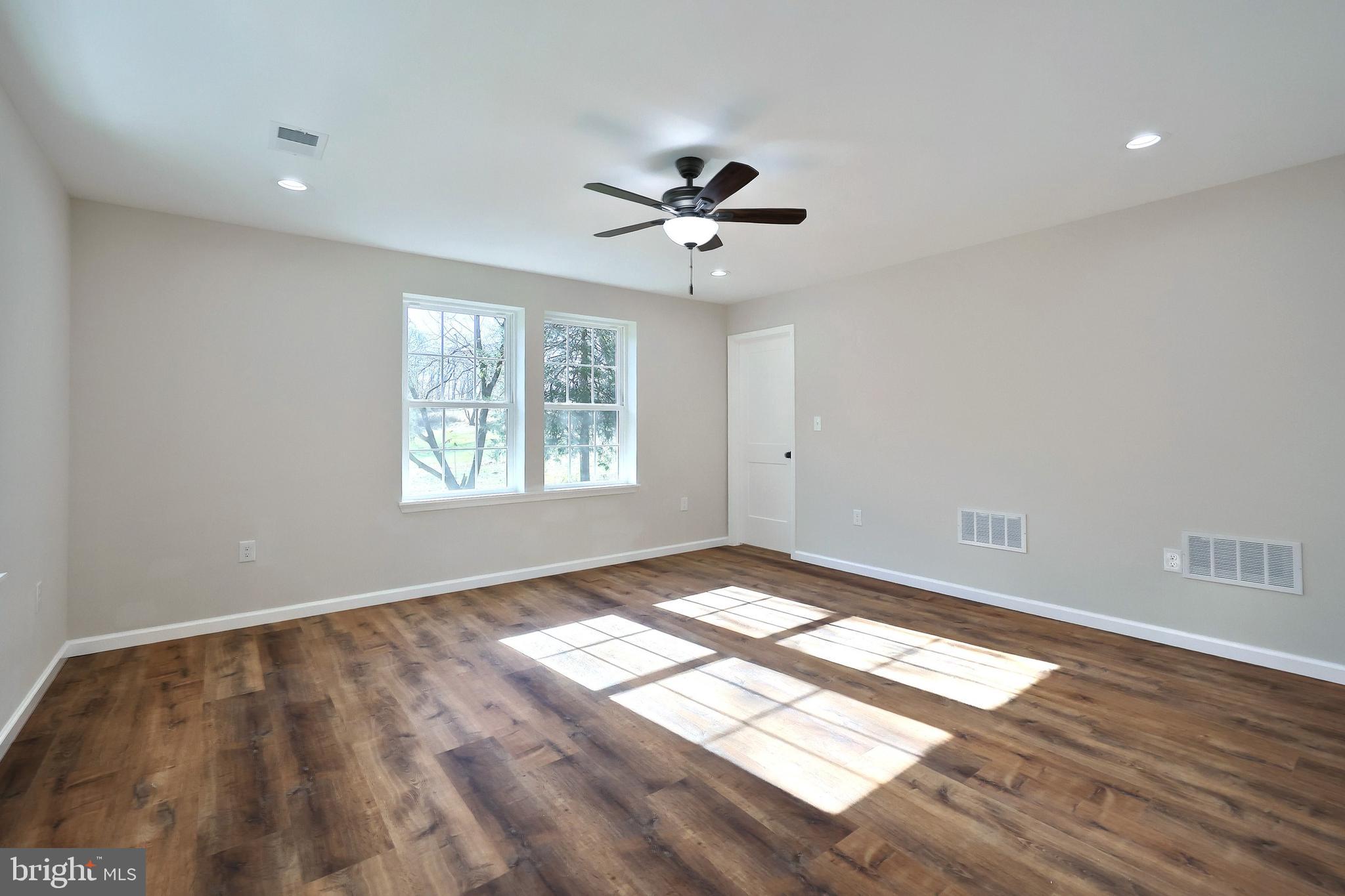 10640 Enfield Road Felton, PA 17322 - Photo 53 of 59 a view of an empty room and window and wooden floor