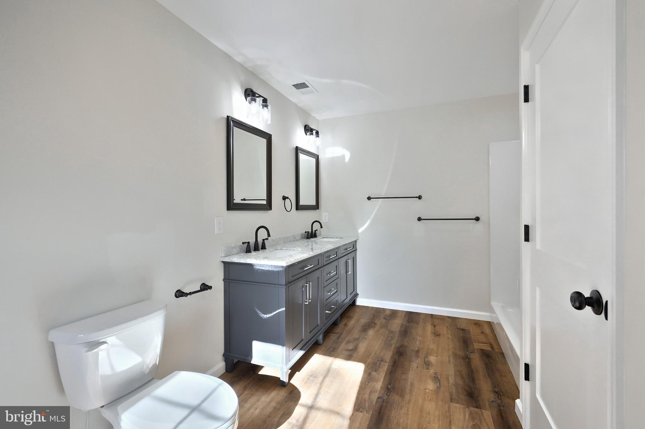 10640 Enfield Road Felton, PA 17322 - Photo 55 of 59 a bathroom with a sink and a mirror