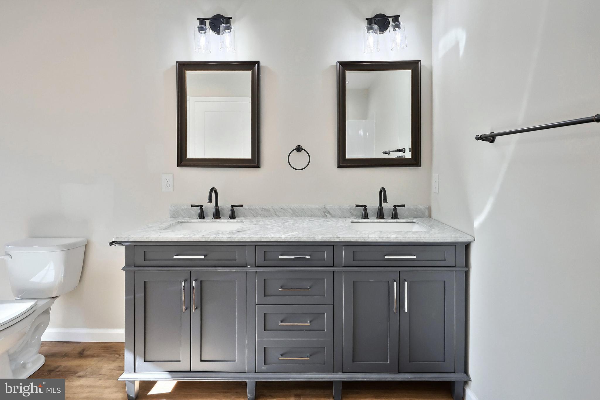 10640 Enfield Road Felton, PA 17322 - Photo 56 of 59 a bathroom with 2 sink and a toilet