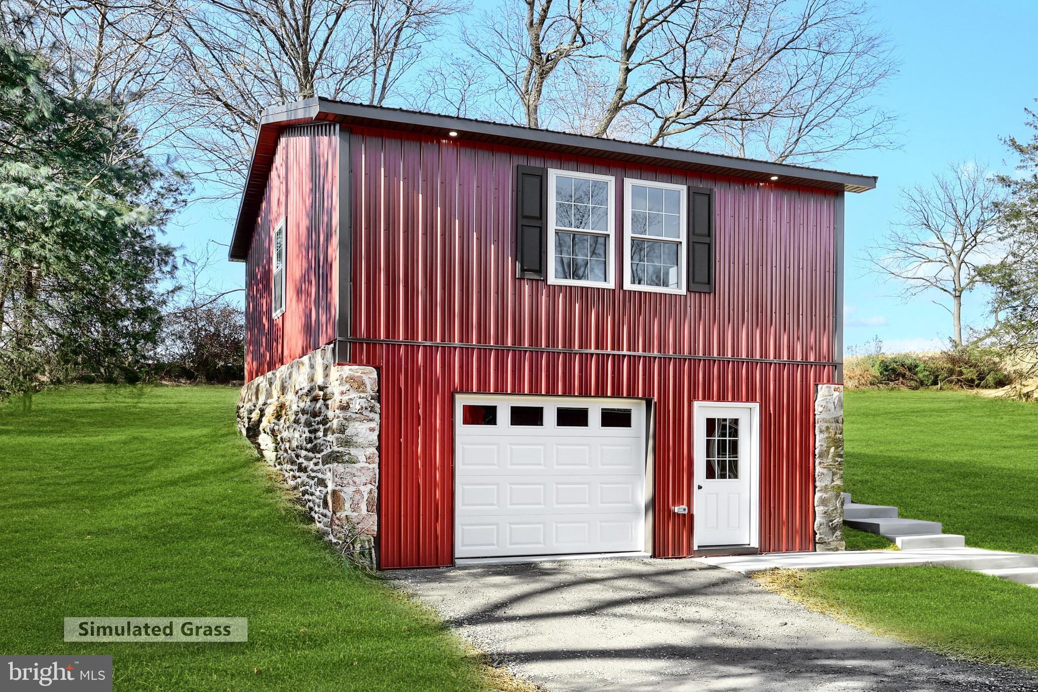 10640 Enfield Road Felton, PA 17322 - Photo 6 of 59 a front view of a house with garden
