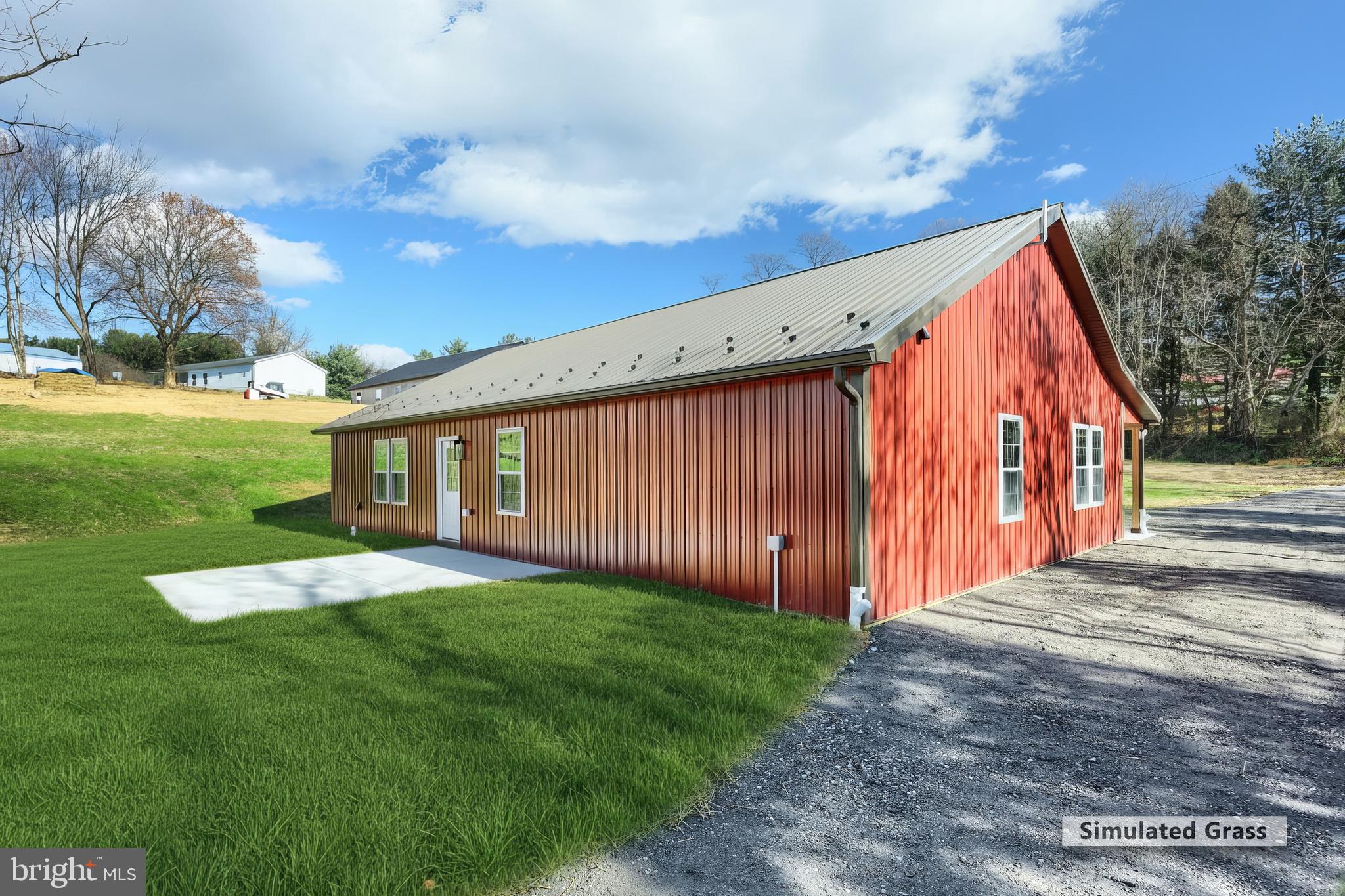 10640 Enfield Road Felton, PA 17322 - Photo 10 of 59 a view of backyard with huge green area and wooden fence