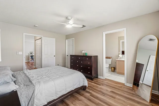 a workspace with wooden floor and a window