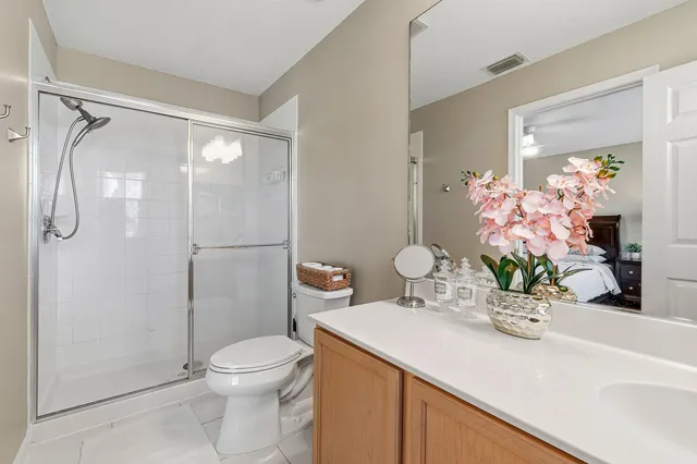 a room with a walk in closet and wooden floor