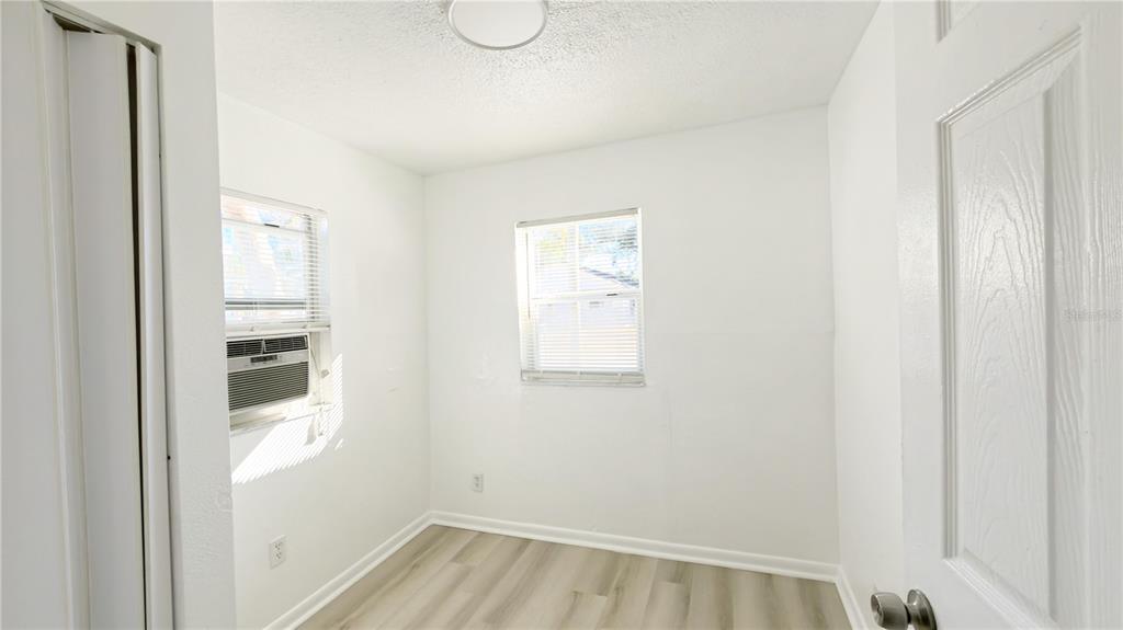 8204 North Semmes Street Tampa, FL 33604 - Photo 12 of 14 a view of a hallway with wooden floor and a window