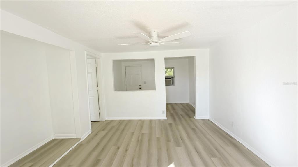 8204 North Semmes Street Tampa, FL 33604 - Photo 3 of 14 a view of hallway with wooden floor