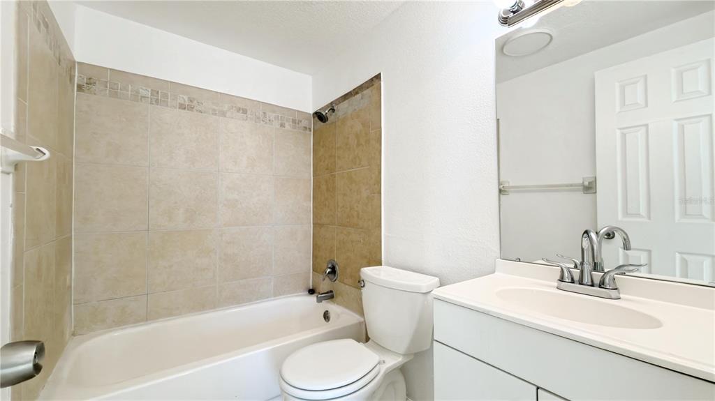 8204 North Semmes Street Tampa, FL 33604 - Photo 9 of 14 a bathroom with a sink toilet and shower