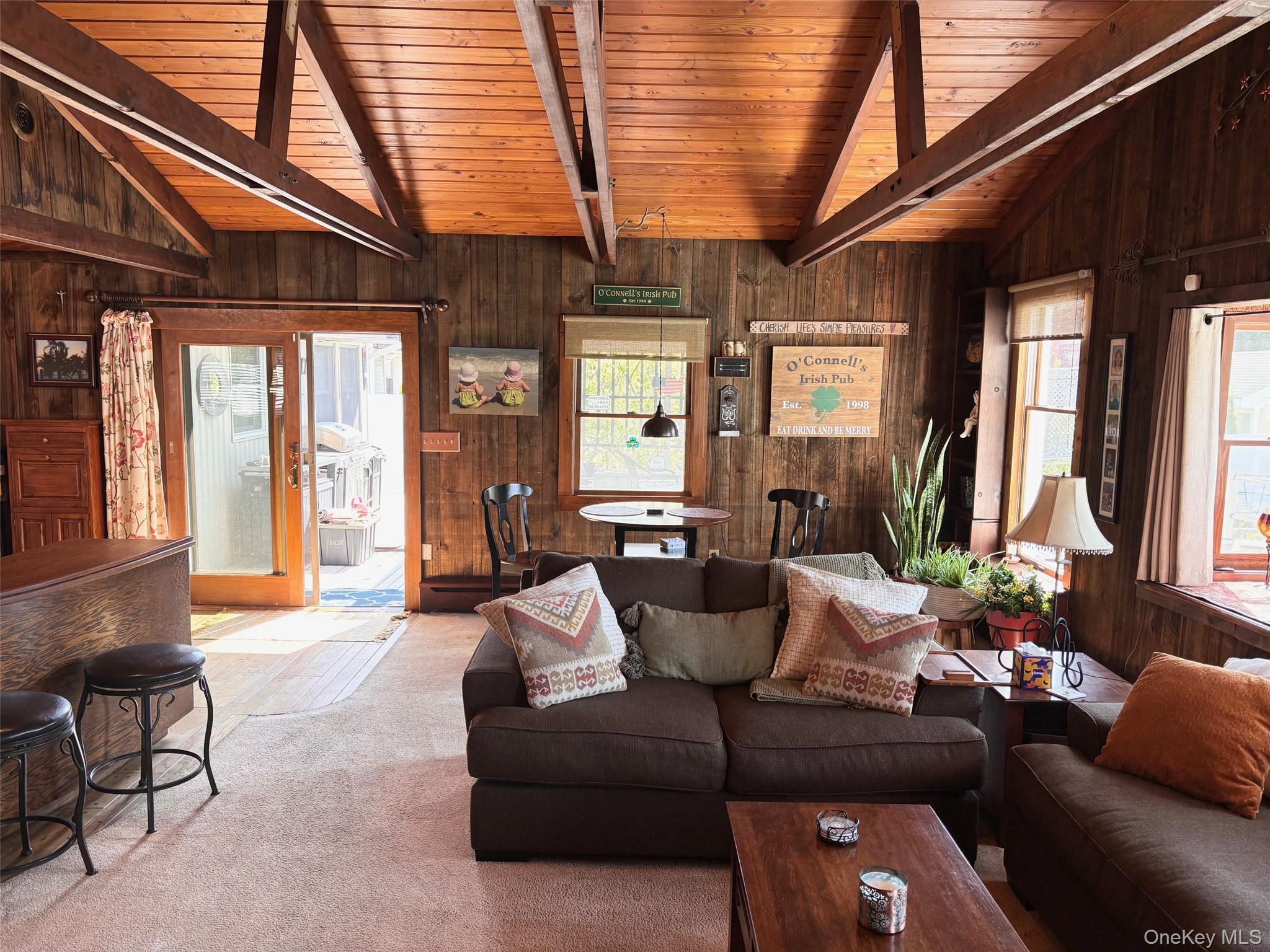 212 Matthews Road Oakdale, NY 11769 - Photo 8 of 38 Vaulted wood-paneled ceiling with exposed beams