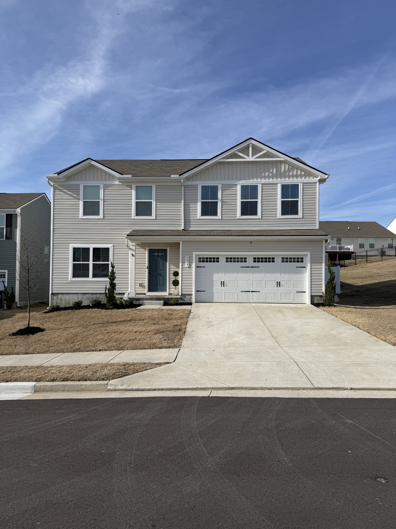 a front view of a house with a yard