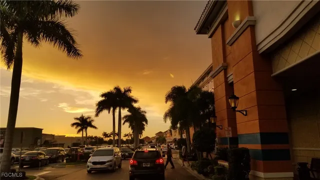 a view of car parked on the roadside