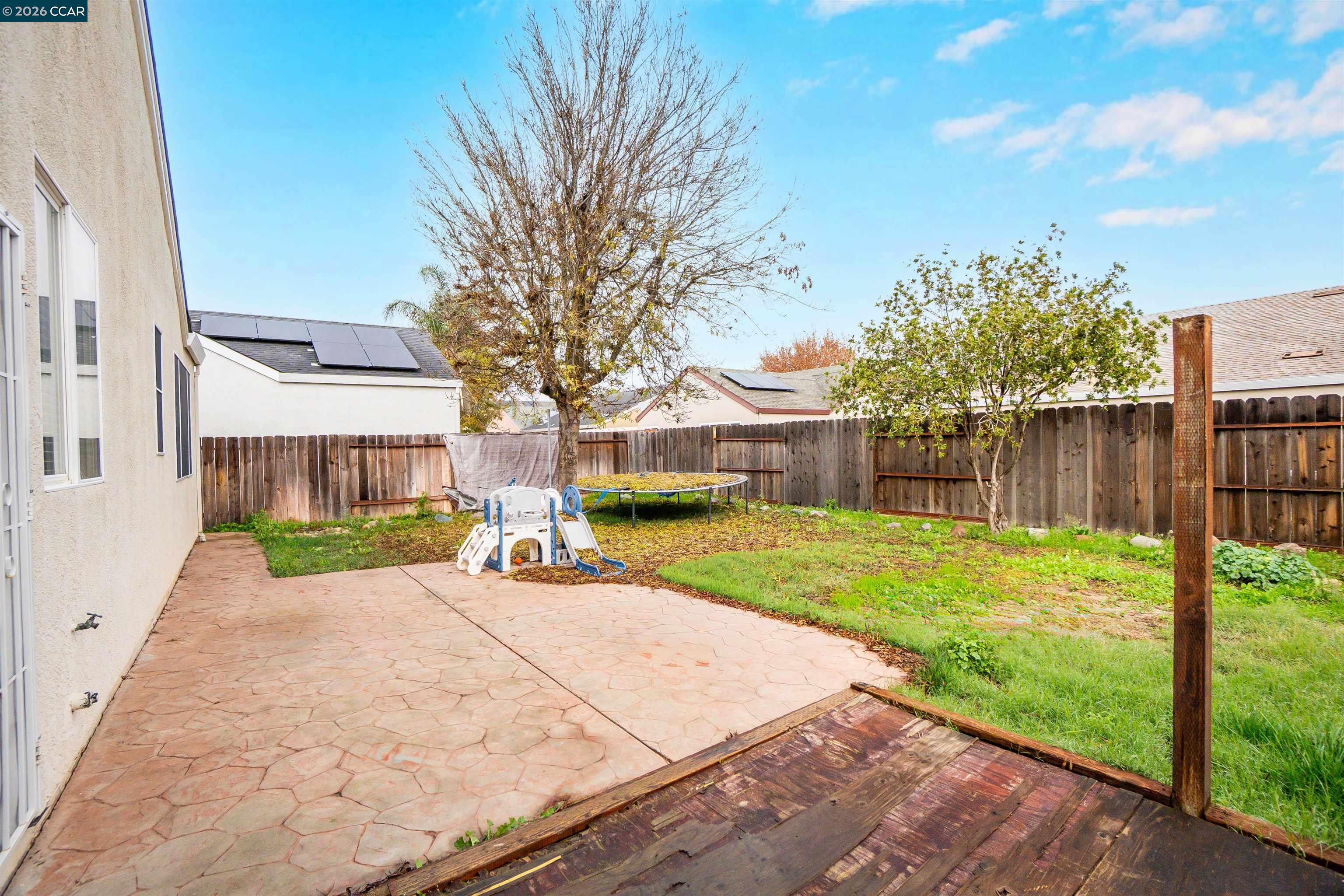 686 Anderson Way Rio Vista, CA 94571 - Photo 32 of 36 a view of a house with backyard and a tree