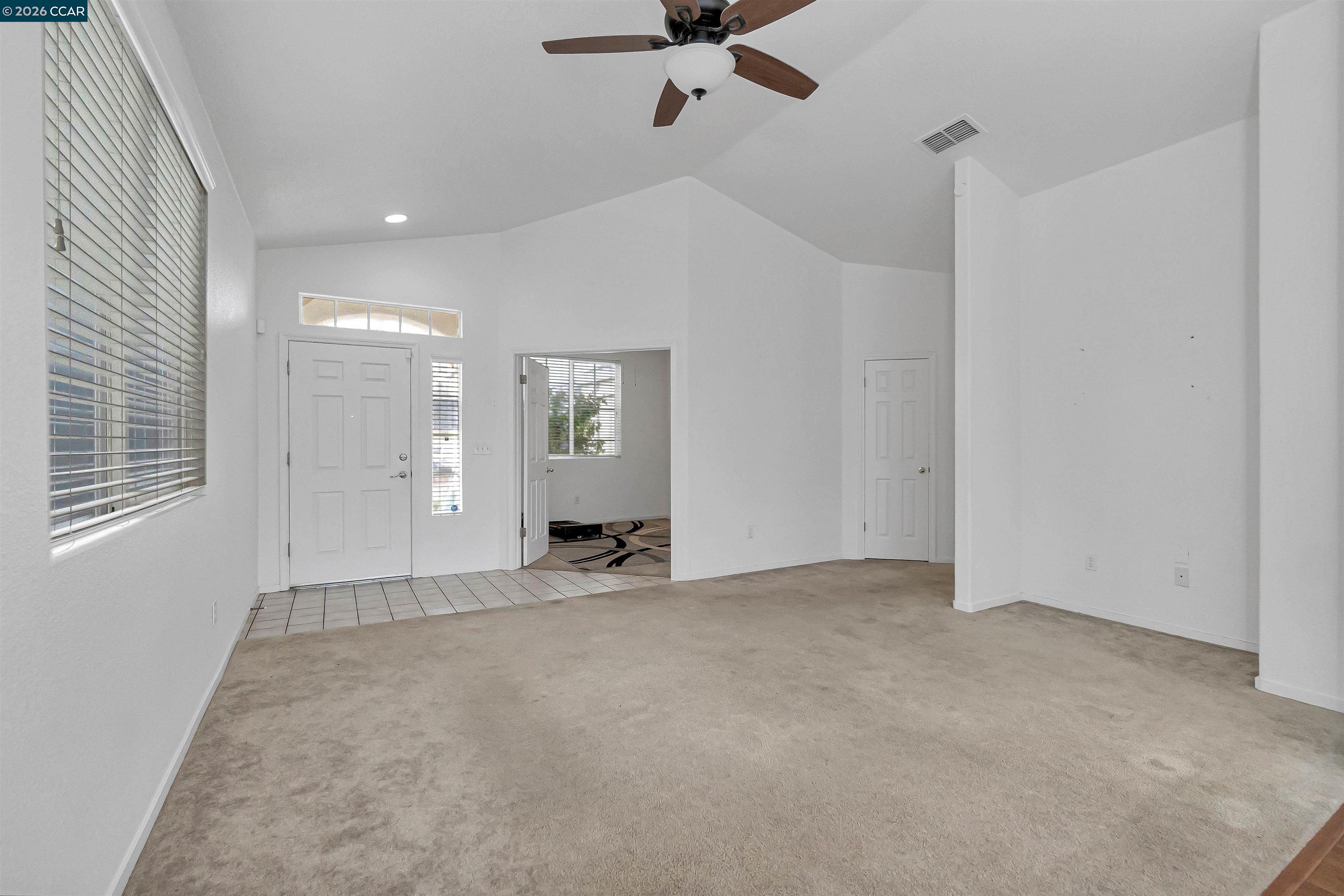 686 Anderson Way Rio Vista, CA 94571 - Photo 9 of 36 an empty room with fan and windows