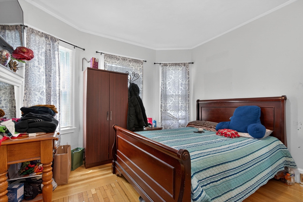 1748 North Shore Road Revere, MA 02151 - Photo 15 of 20 a bedroom with a bed and a window