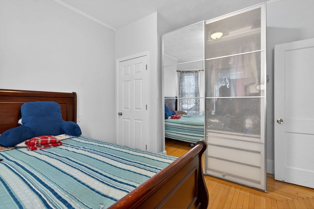 1748 North Shore Road Revere, MA 02151 - Photo 16 of 20 a hallway view with two twin beds in it