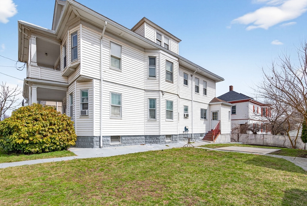 1748 North Shore Road Revere, MA 02151 - Photo 19 of 20 a front view of a house with a yard
