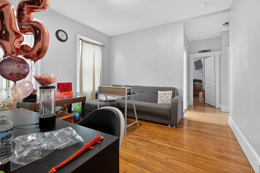 1748 North Shore Road Revere, MA 02151 - Photo 8 of 20 a living room with furniture and a couch
