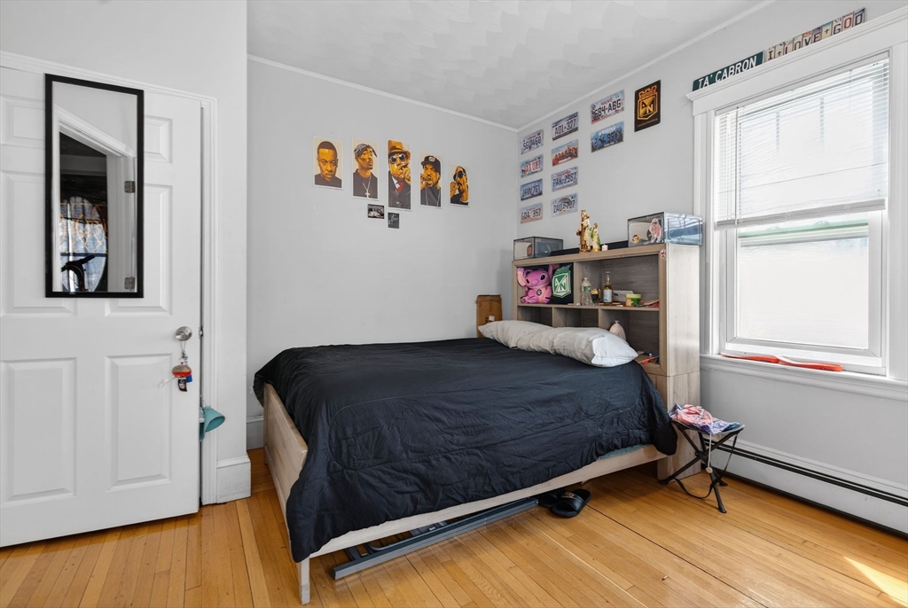 1748 North Shore Road Revere, MA 02151 - Photo 10 of 20 a bedroom with a bed and a window