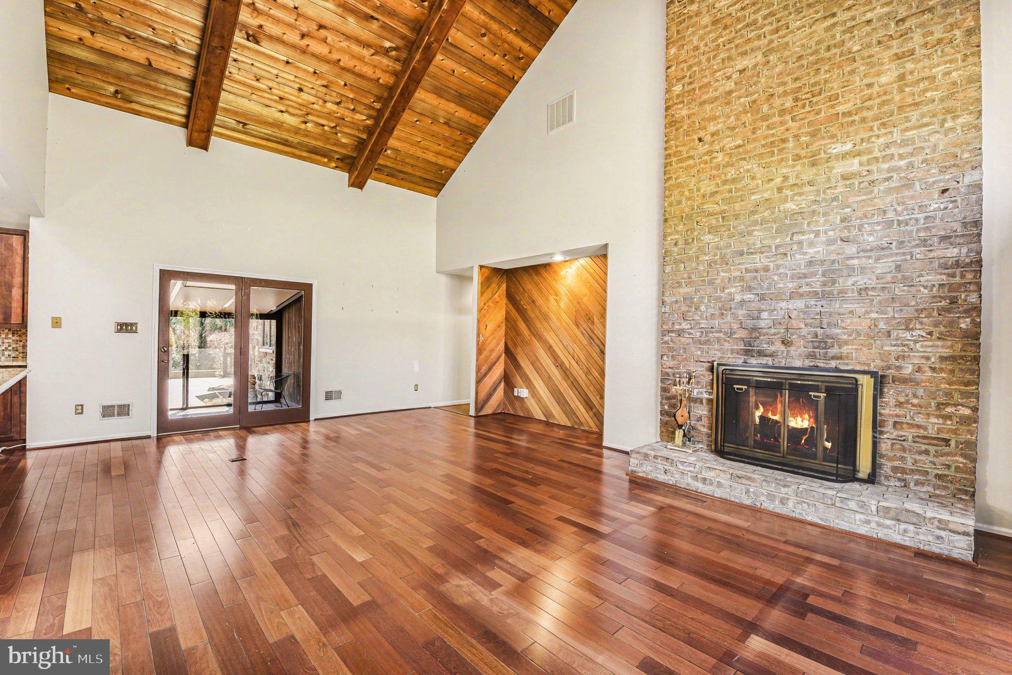 13800 Cripplegate Road Phoenix, MD 21131 - Photo 14 of 47 a view of empty room with wooden floor and fireplace
