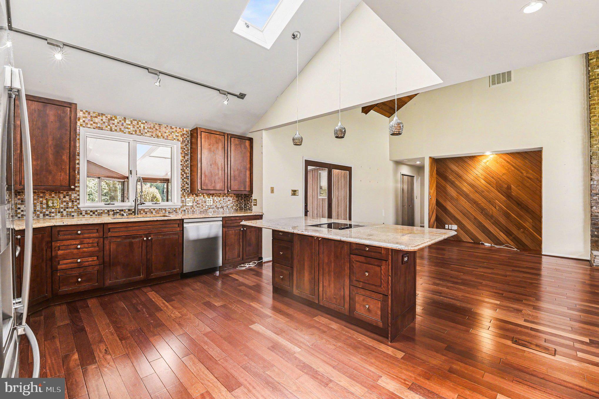 13800 Cripplegate Road Phoenix, MD 21131 - Photo 16 of 47 a kitchen with wooden floors and wooden cabinets