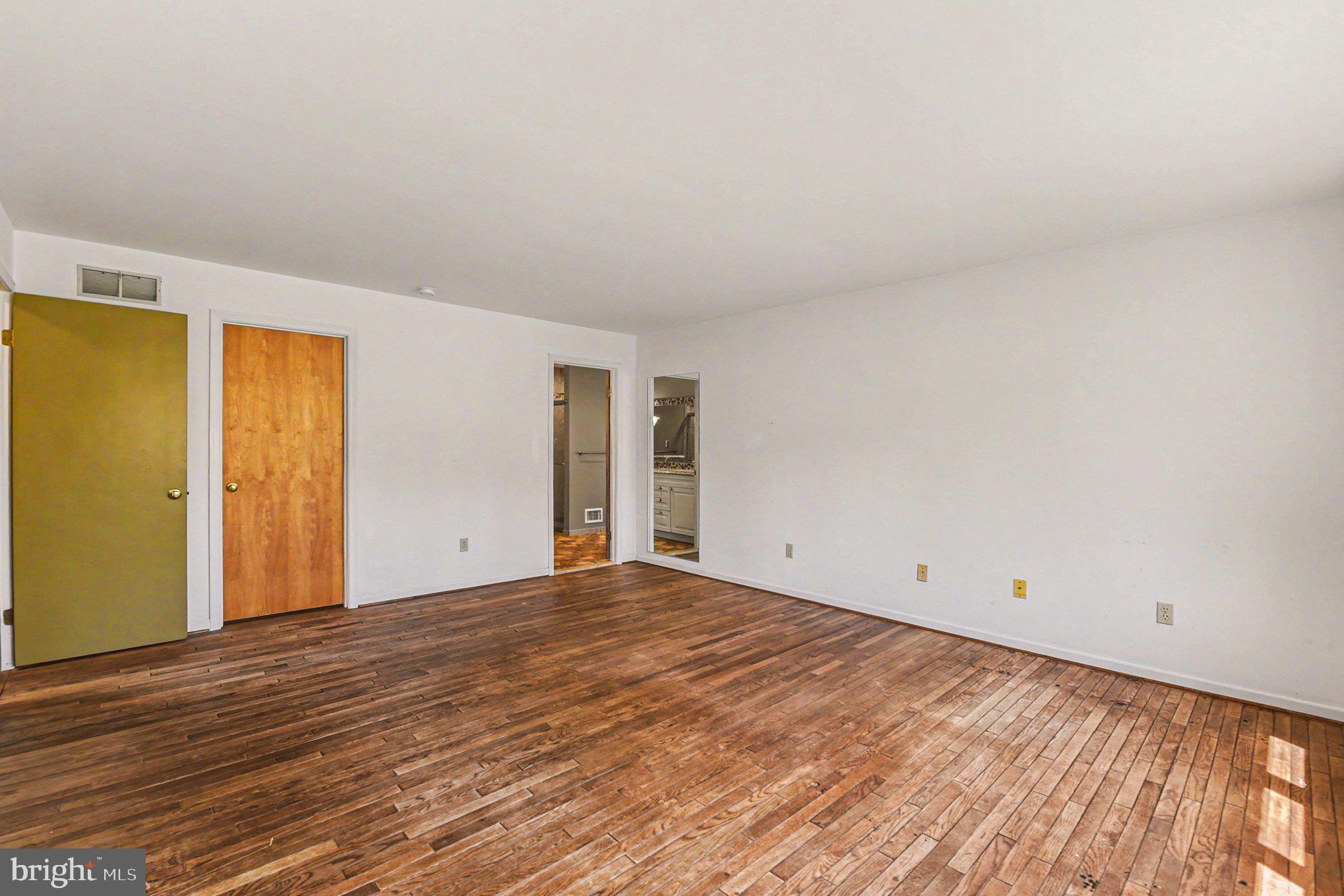 13800 Cripplegate Road Phoenix, MD 21131 - Photo 22 of 47 a view of an empty room with wooden floor