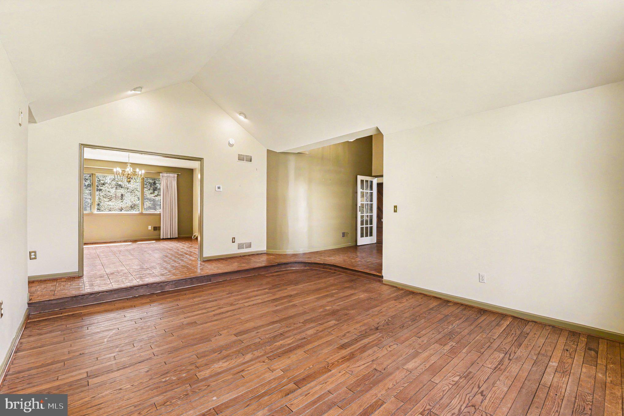 13800 Cripplegate Road Phoenix, MD 21131 - Photo 24 of 47 an empty room with wooden floor and windows