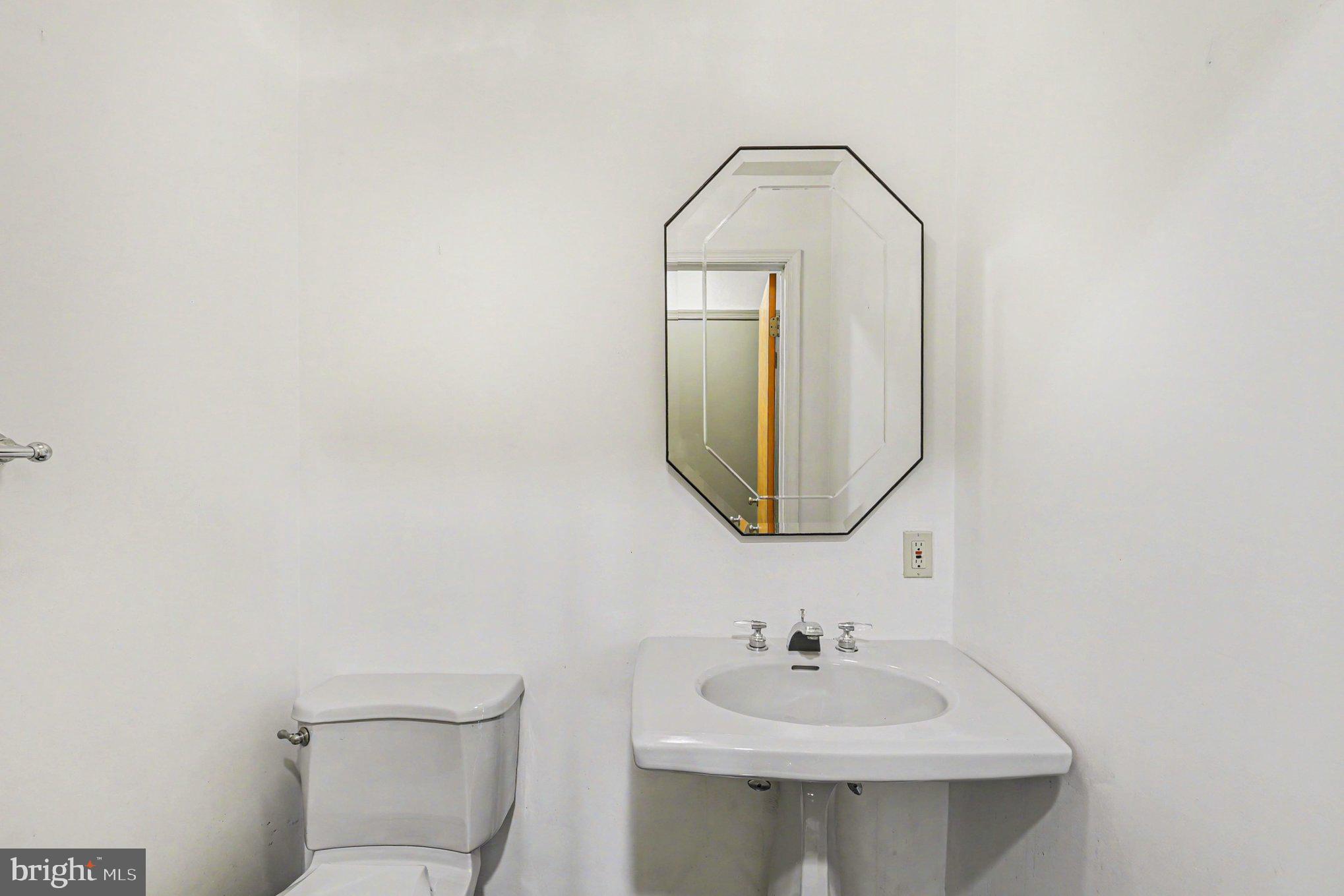 13800 Cripplegate Road Phoenix, MD 21131 - Photo 30 of 47 a bathroom with a sink and a mirror