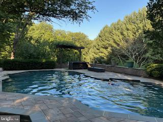 13800 Cripplegate Road Phoenix, MD 21131 - Photo 3 of 4 Serene poolside retreat in nature.