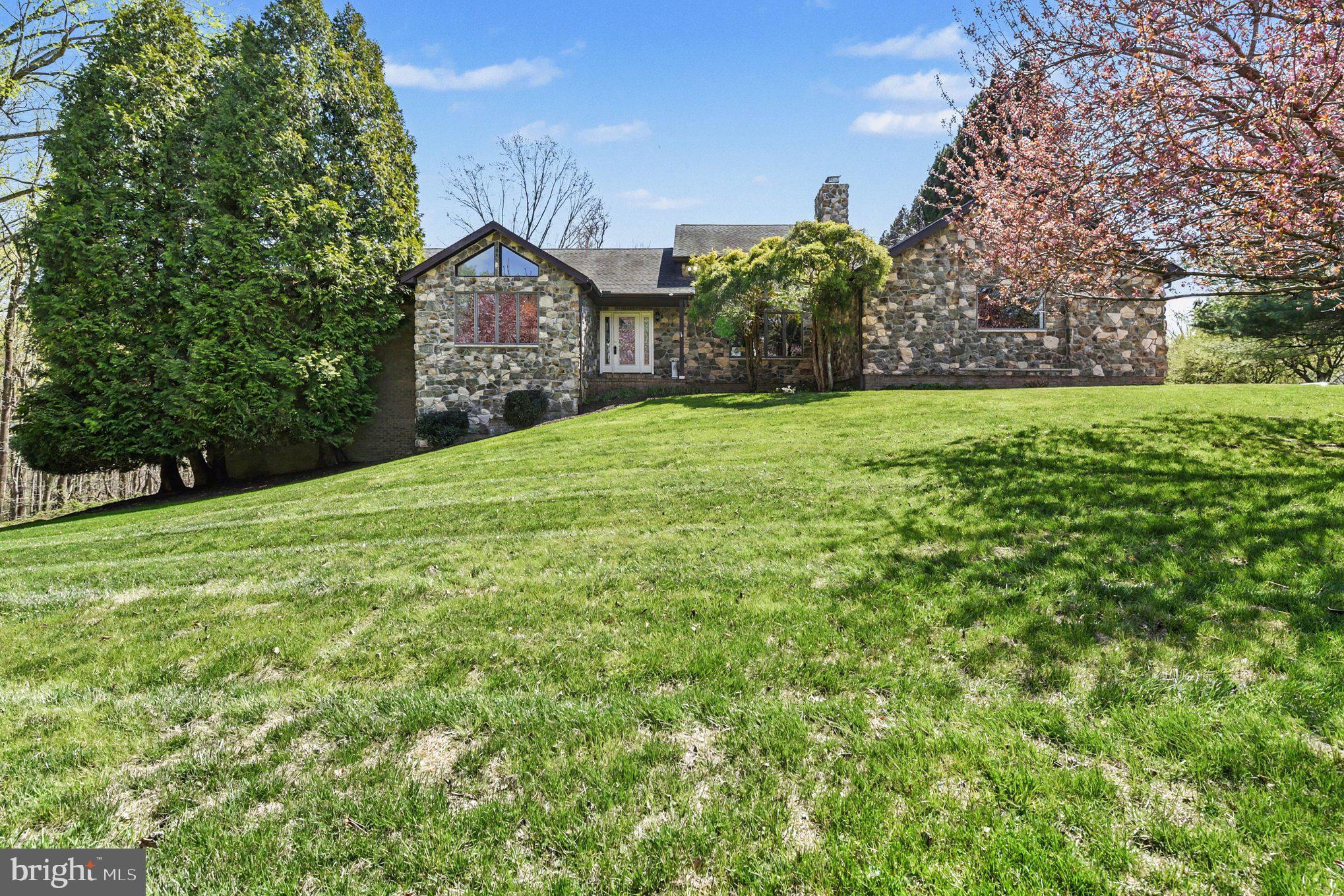 13800 Cripplegate Road Phoenix, MD 21131 - Photo 3 of 47 a view of a house with a yard and potted plants