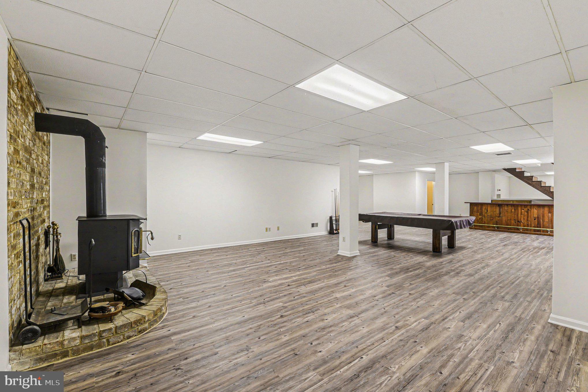 13800 Cripplegate Road Phoenix, MD 21131 - Photo 32 of 47 a view of a room with wooden floor and windows