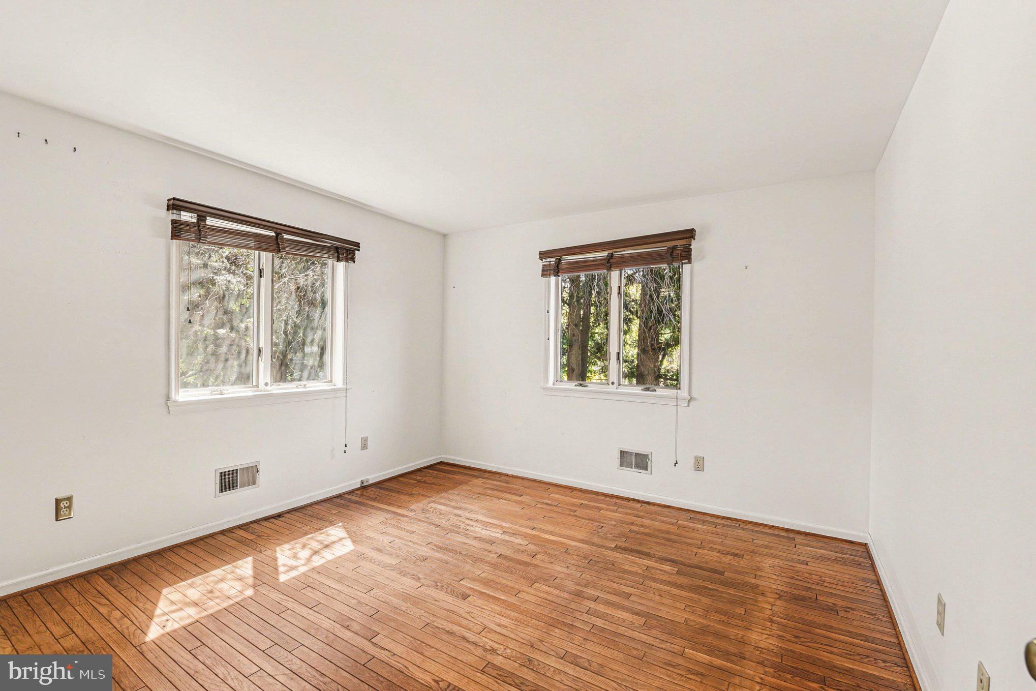 13800 Cripplegate Road Phoenix, MD 21131 - Photo 34 of 47 an empty room with wooden floor and windows