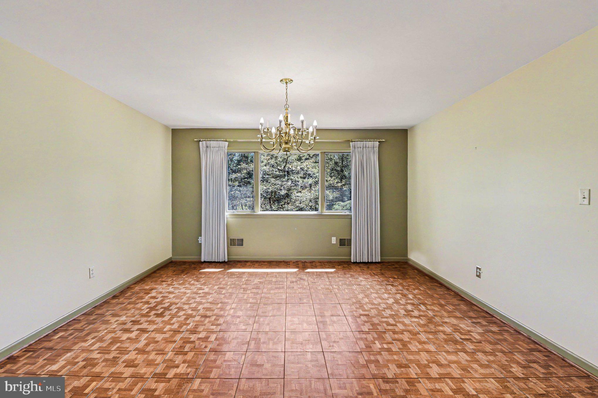 13800 Cripplegate Road Phoenix, MD 21131 - Photo 36 of 47 an empty room with windows and chandelier